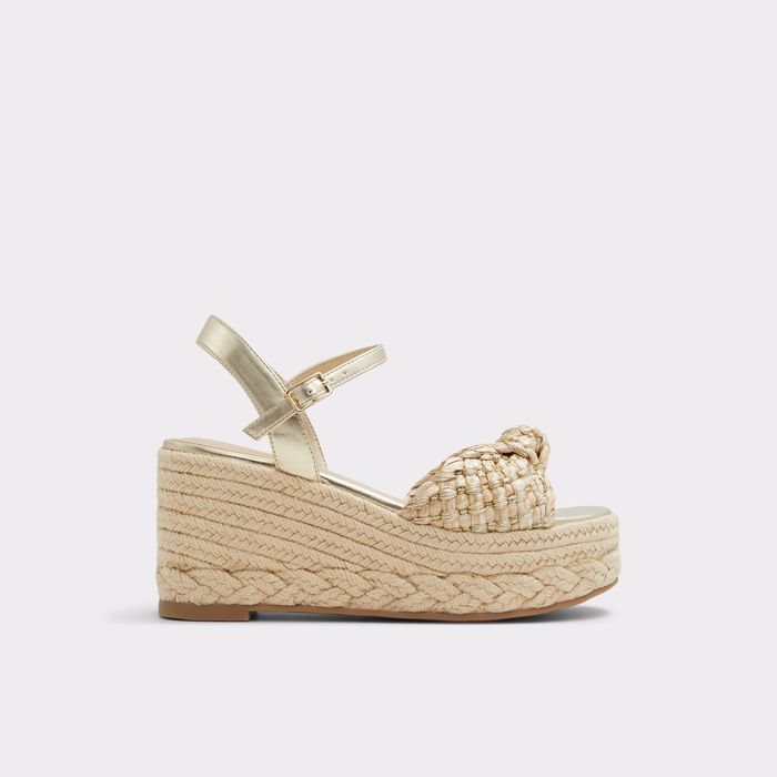 Wedge heeled sandals in gold - ANNAMARIE