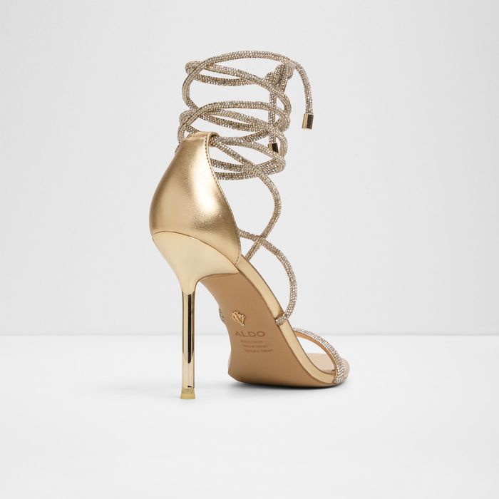 Stiletto heeled sandals in gold - CALADONIA