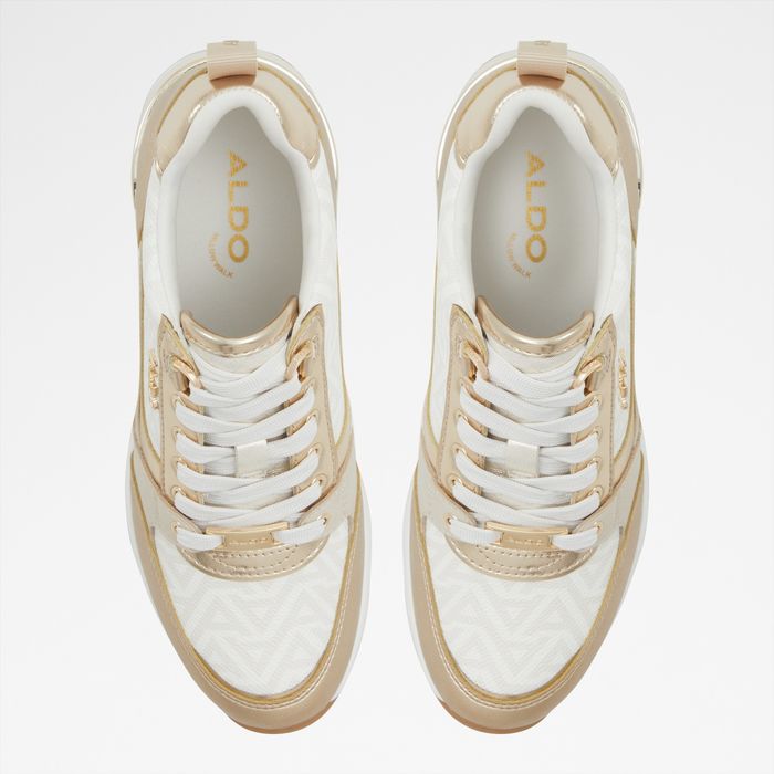 Wedge heeled trainers in gold - CAROTERIEL