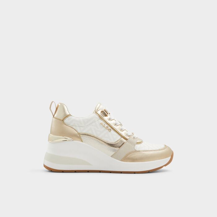 Wedge heeled trainers in gold - CAROTERIEL