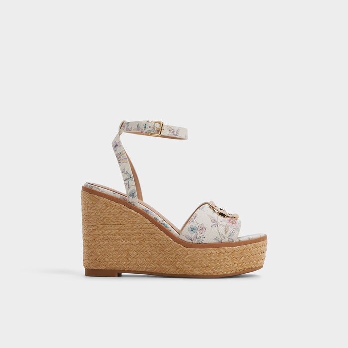 Wedge heeled sandals in white - CARRABRIRIA