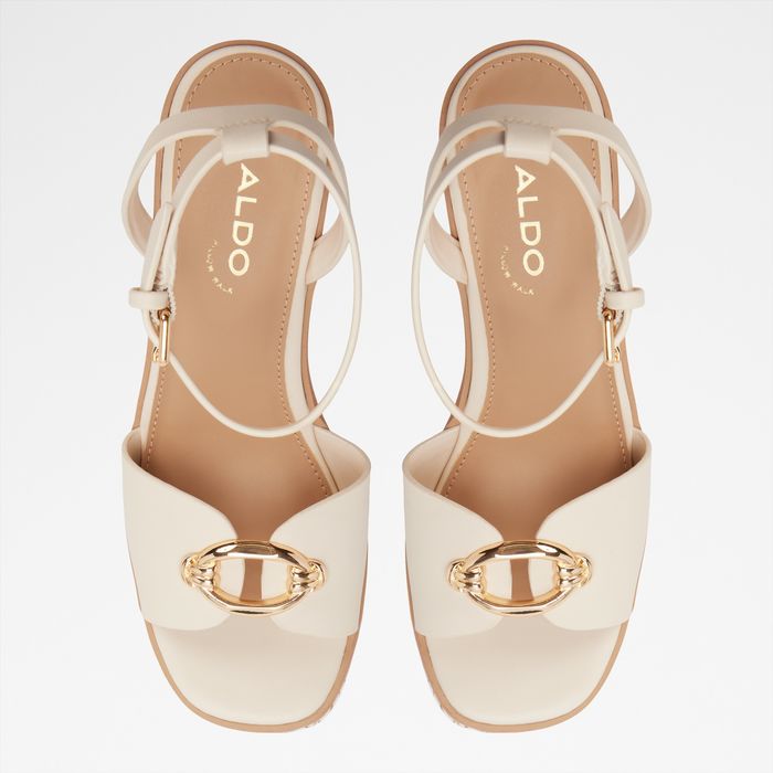 Wedge heeled sandals in beige - CARRABRIRIEL