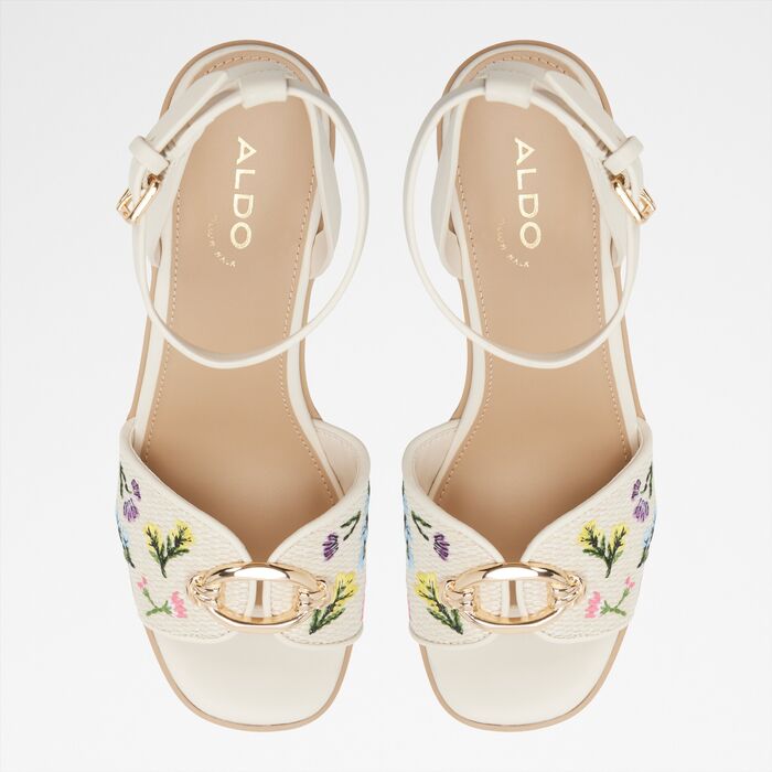 Wedge heeled sandals in beige - CARRABRIRIEL