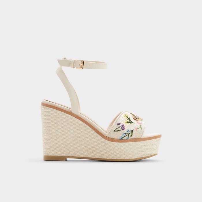 Wedge heeled sandals in beige - CARRABRIRIEL