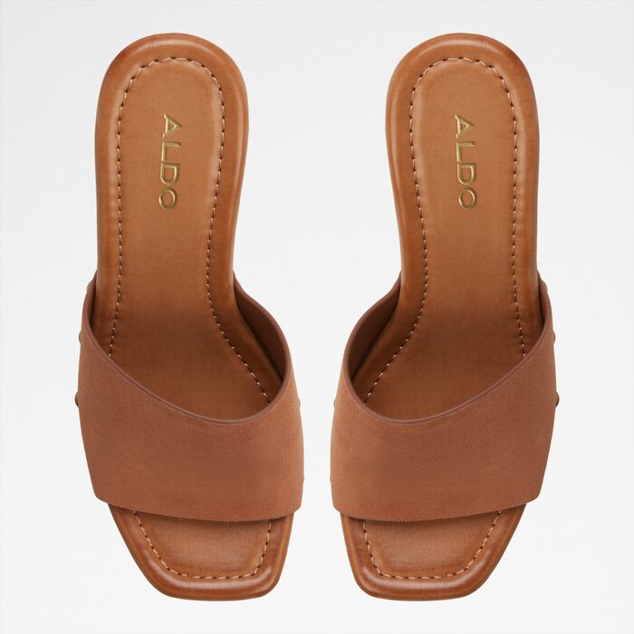 Wedge heeled mules in cognac leather - GROUNDED