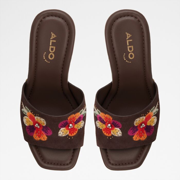 Wedge heeled mules in brown leather - GROUNDED