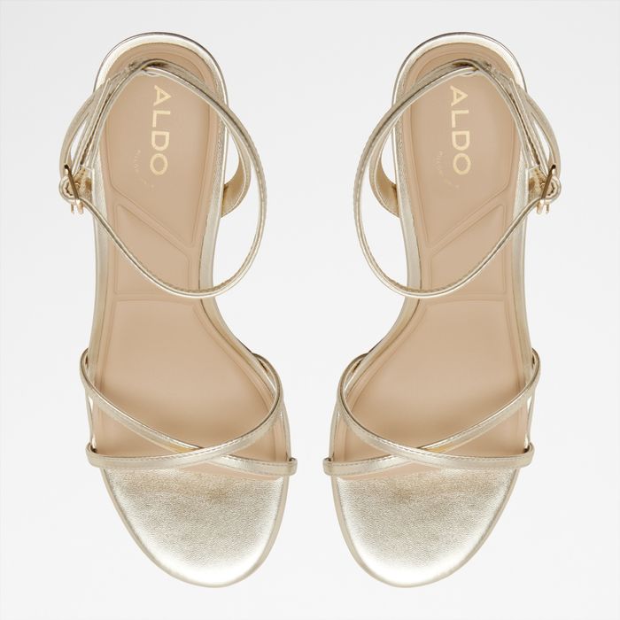 Stiletto heeled sandals in gold - MARBELA