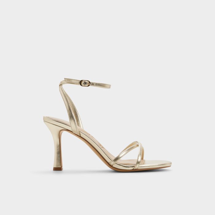 Stiletto heeled sandals in gold - MARBELA