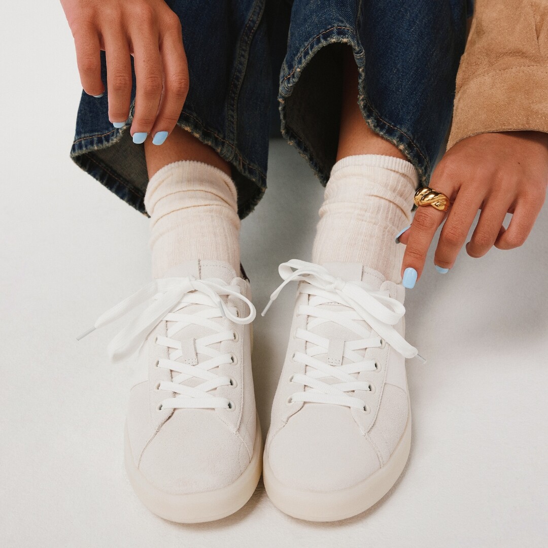 Classic white lace-up sneakers with minimalist design