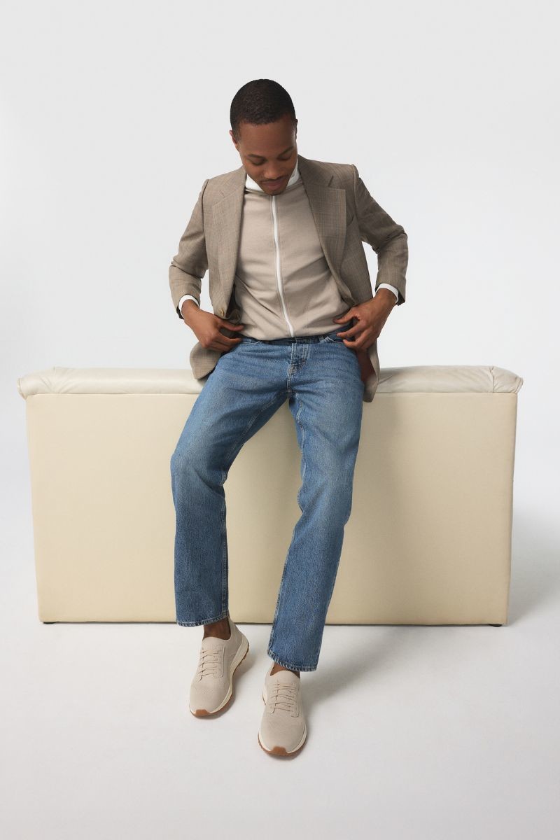 Beige athletic sneakers with lightweight rubber sole.