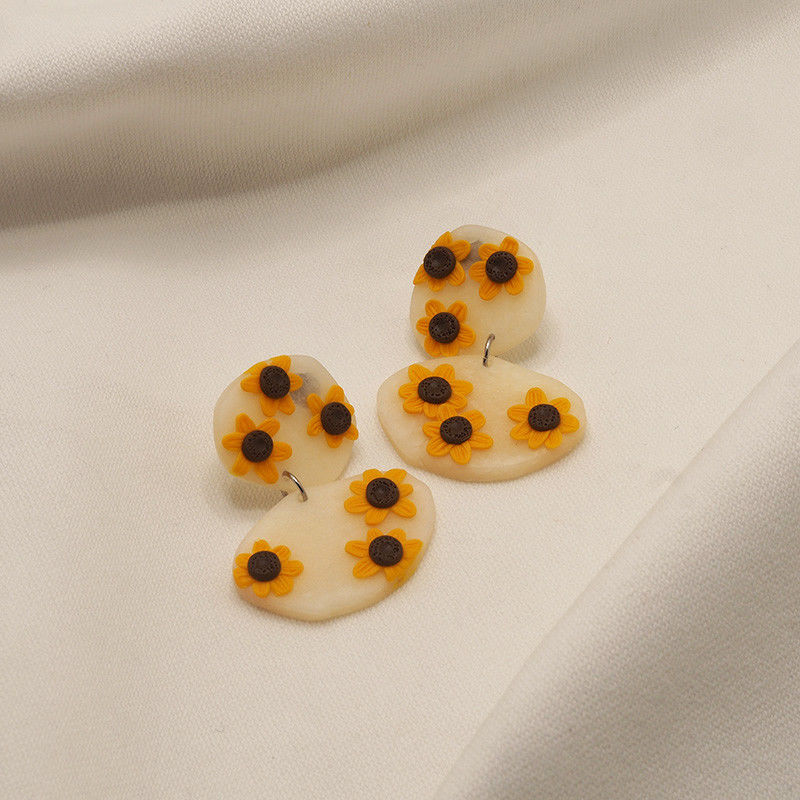 brincos girassois argolas prateadas