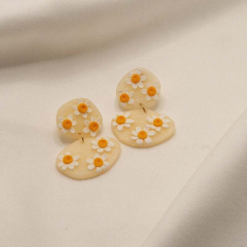 brincos com margaridas