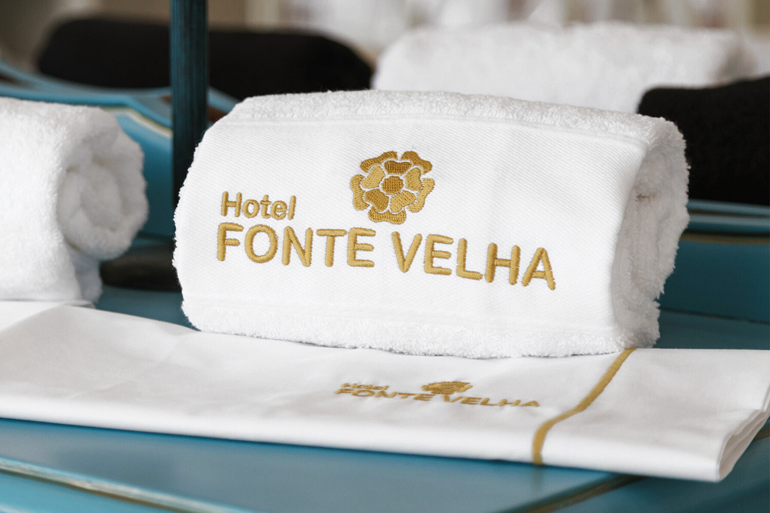 white hotel bath towel with embroidered logo