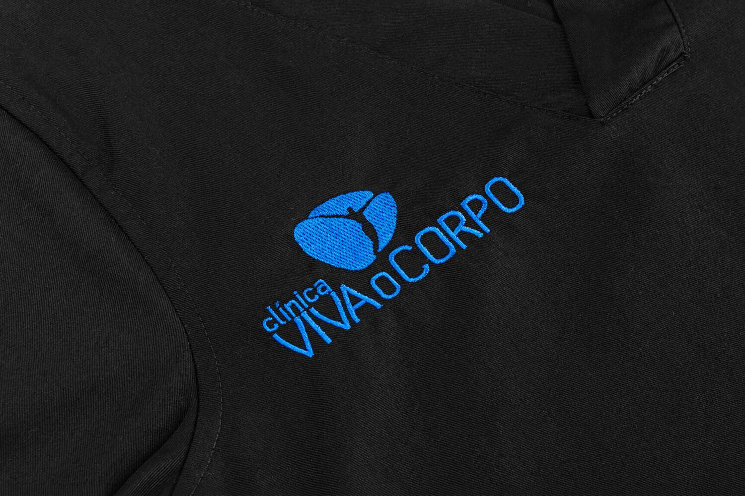 black clinic tunic blouse with embroidered logo
