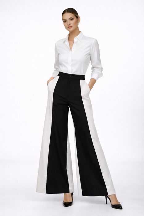 Conjunto com camisa branca clássica e calça wide leg bicolor preta e branca, de proposta elegante, moderna e sofisticada.