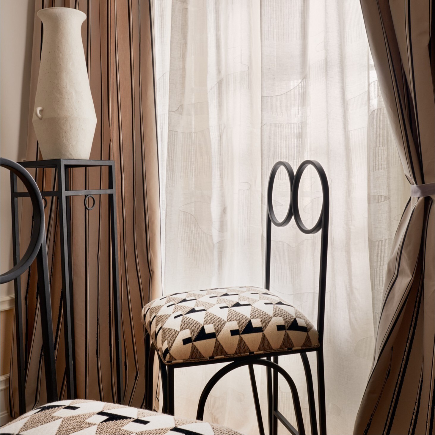 Handcrafted bar chair from MAMOA, blending timeless aesthetics with artisanal detail.