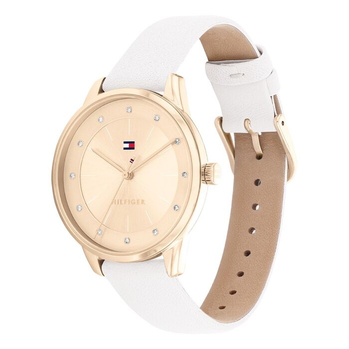 Vista lateral de relógio Tommy Hilfiger com bracelete em pele branca e de mostrador rosa com pedras.