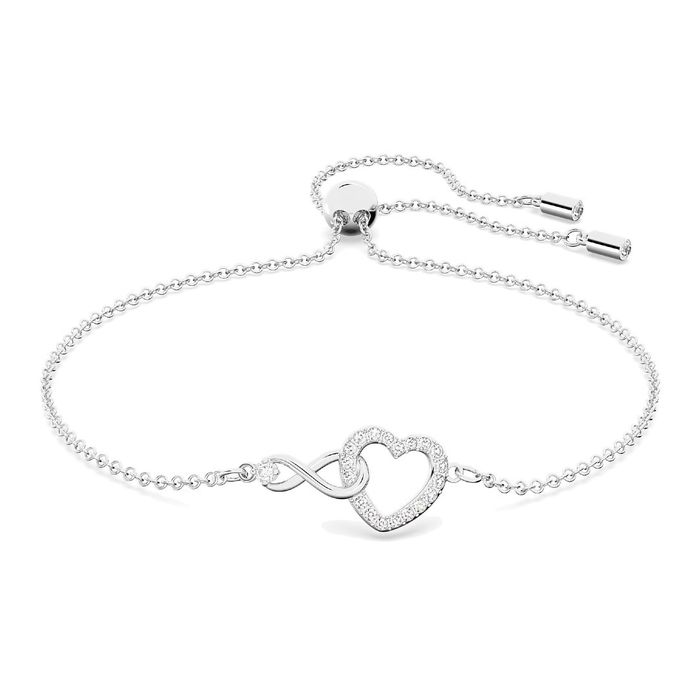 Pulseira prateada da Swarovski com o símbolo do infinito entrelaçado a um coração com cristais.