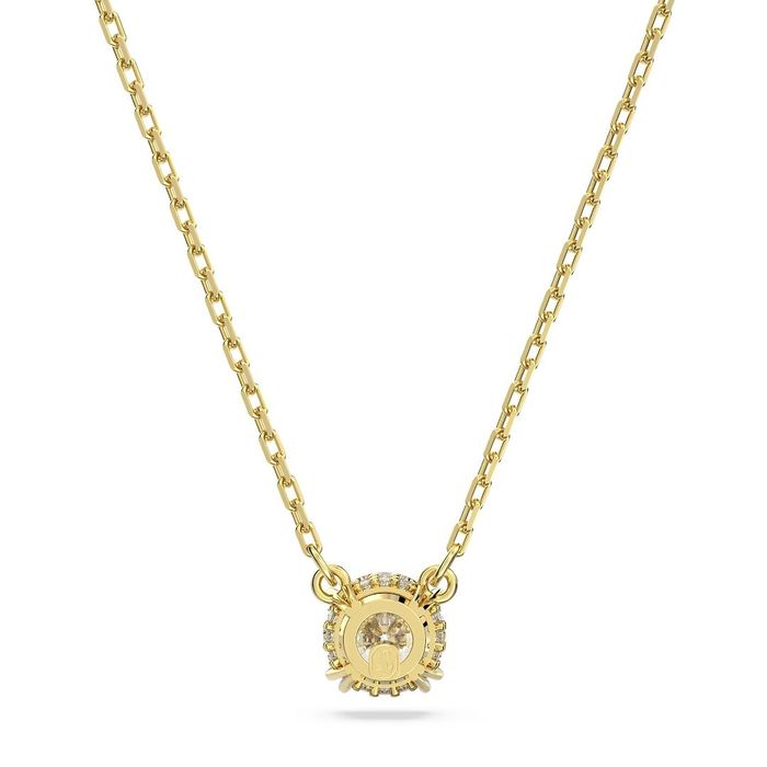 Vista traseira de um colar dourado Swarovski com um pendente circular uma pedra na frente.