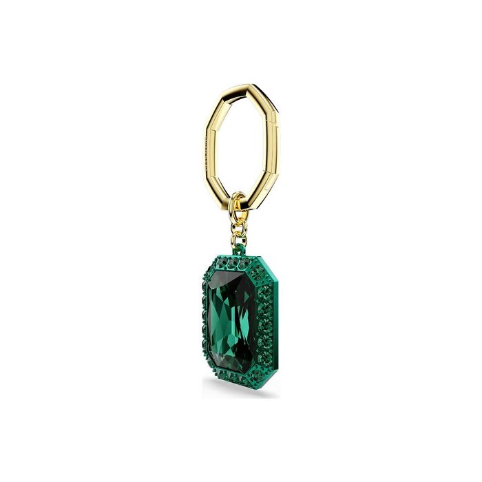 Porta-chaves dourado Swarovski, de lado, com um pendente com cristais e uma pedra verde no centro.