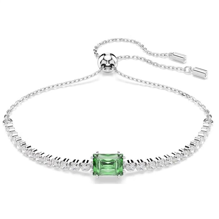 Pulseira prateada Swarovski com cristais incolores e com uma pedra verde retangular no centro.