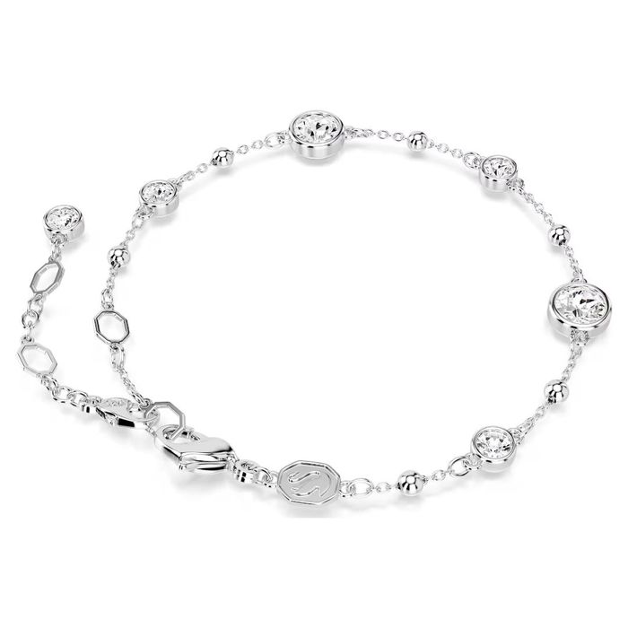 Vista traseira de uma pulseira Swarovski com elementos circulares prateados com cristais cravados.