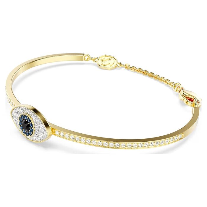 Pulseira dourada Swarovski, de lado, com a forma de um olho com cristais brancos, azuis e preto.