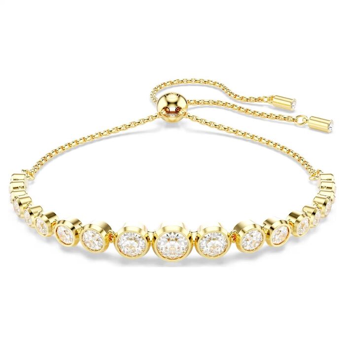 Pulseira dourada Swarovski de fecho em bola deslizante e com cristais incolores na frente.