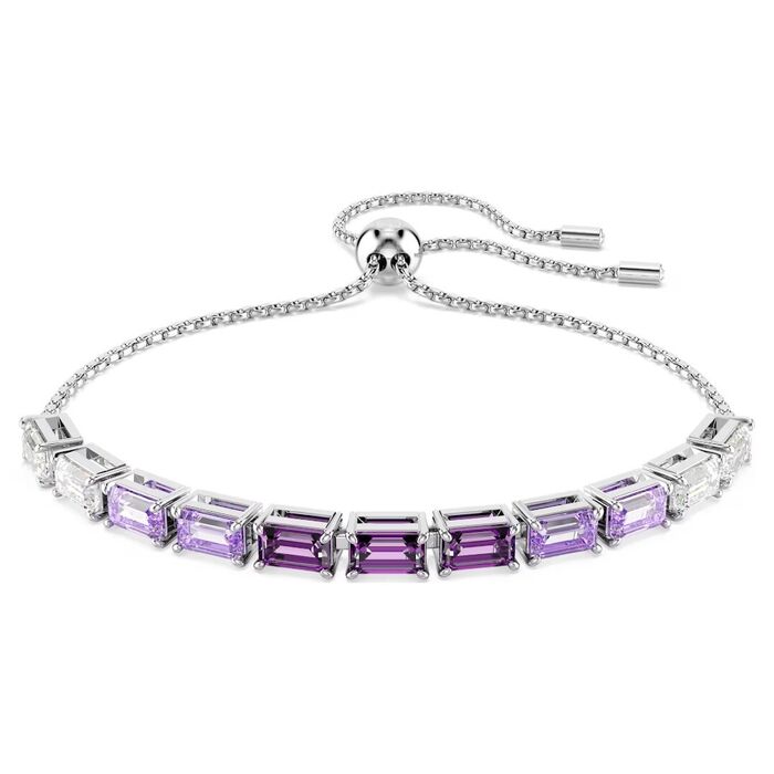 Pulseira prateada Swarovski com cristais roxos e incolores e um fecho em bola deslizante.