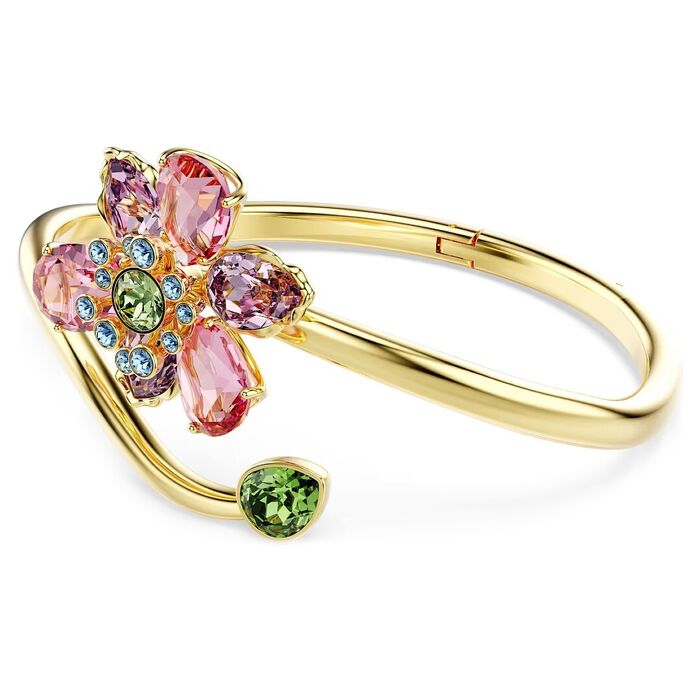 Pulseira Swarovski dourada, de lado, com uma flor com caule com cristais rosa, azuis e verdes.