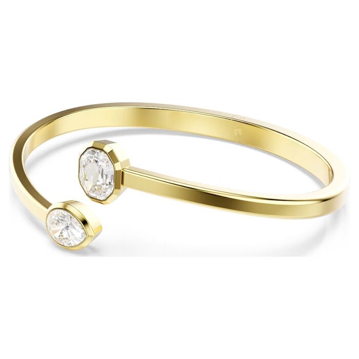 Pulseira feminina da Swarovski dourada, de lado, com um cristal incolor em cada ponta.