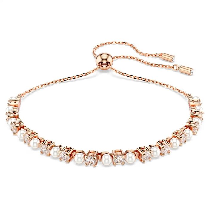 Pulseira feminina Swarovski em aço rosa com cravação de cristais Swarovski e pérolas sintéticas.
