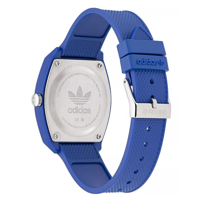 Relógio Adidas quartzo visto por trás com a tampa prateada com a bracelete em silicone azul.Relógio Adidas quartzo visto por trás com a tampa prateada com a bracelete em silicone azul.