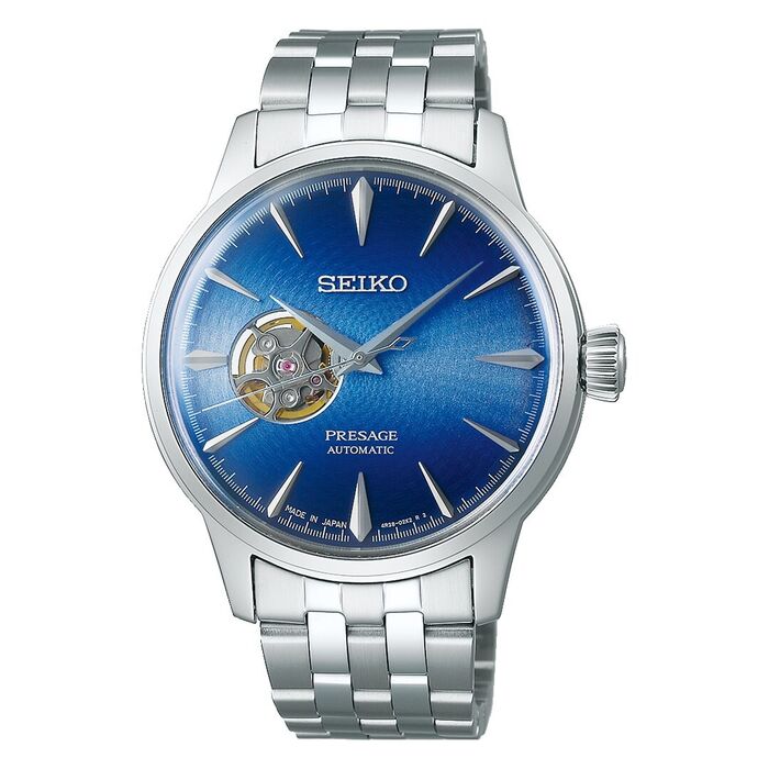 Relógio masculino Seiko Presage, caixa e bracelete prateada, mostrador azul com vista do mecanismo.