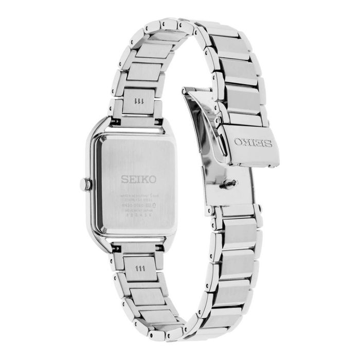 Vista da parte de trás de relógio Seiko feminino com bracelete e caixa em aço e mostrador rosa.
