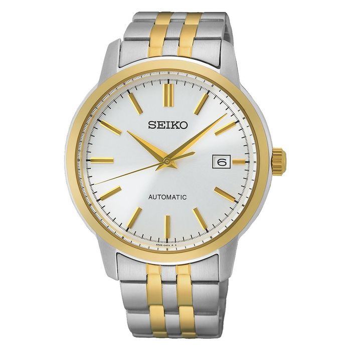 Relógio Seiko de bracelete prateada e dourada com um mostrador branco com calendário.