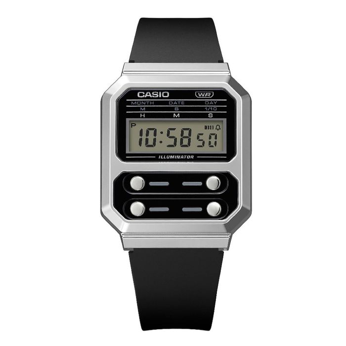 Relógio digital preto com caixa prateada, visor LCD a mostrar 10:58:50 e quatro botões prateados.