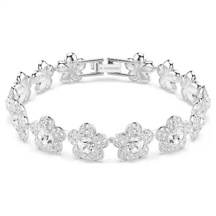 Pulseira feminina em aço prateado Swarovski com uma malha de flores com cristais transparentes.