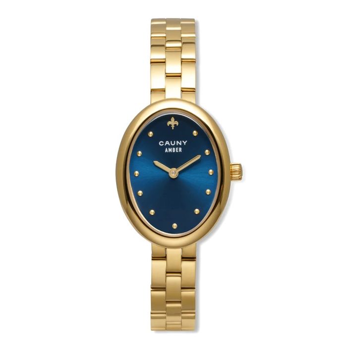 Relógio oval dourado com mostrador azul, marcadores de pontos dourados e pulseira metálica