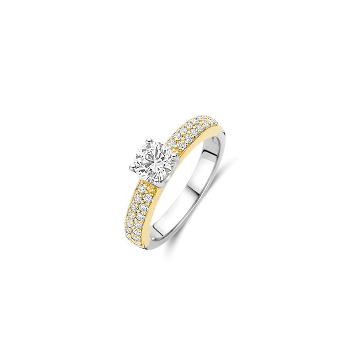 Anel TI SENTO dourado com zircónias no meio uma grande e em volta zircónias pequenas.