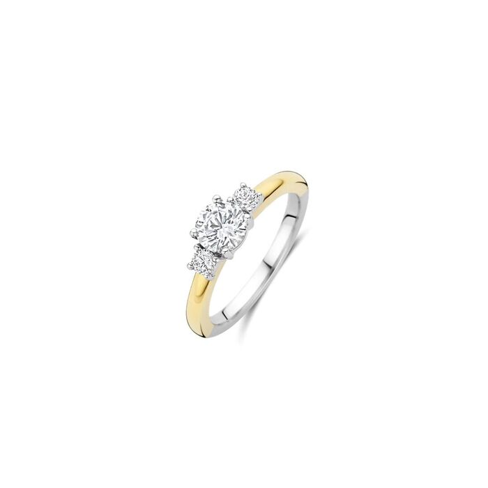 Anel TI SENTO bicolor prateado e dourado com duas zircónias no meio grande e duas pequenas.