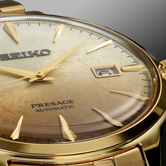 Vista detalhada de relógio masculino Seiko Presage, mostrando detalhe de mostrador dourado.