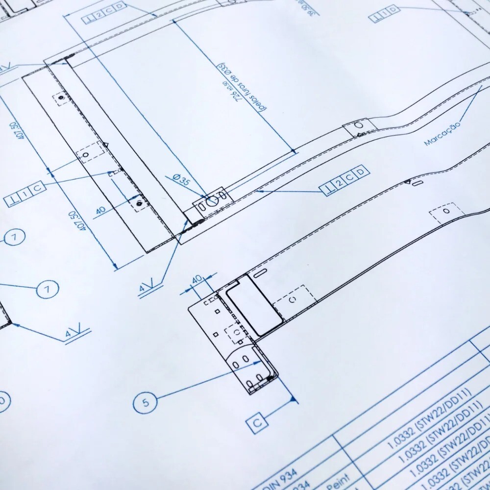 Close-up of a technical drawing with detailed dimensions, showcasing precision engineering and design documentation.