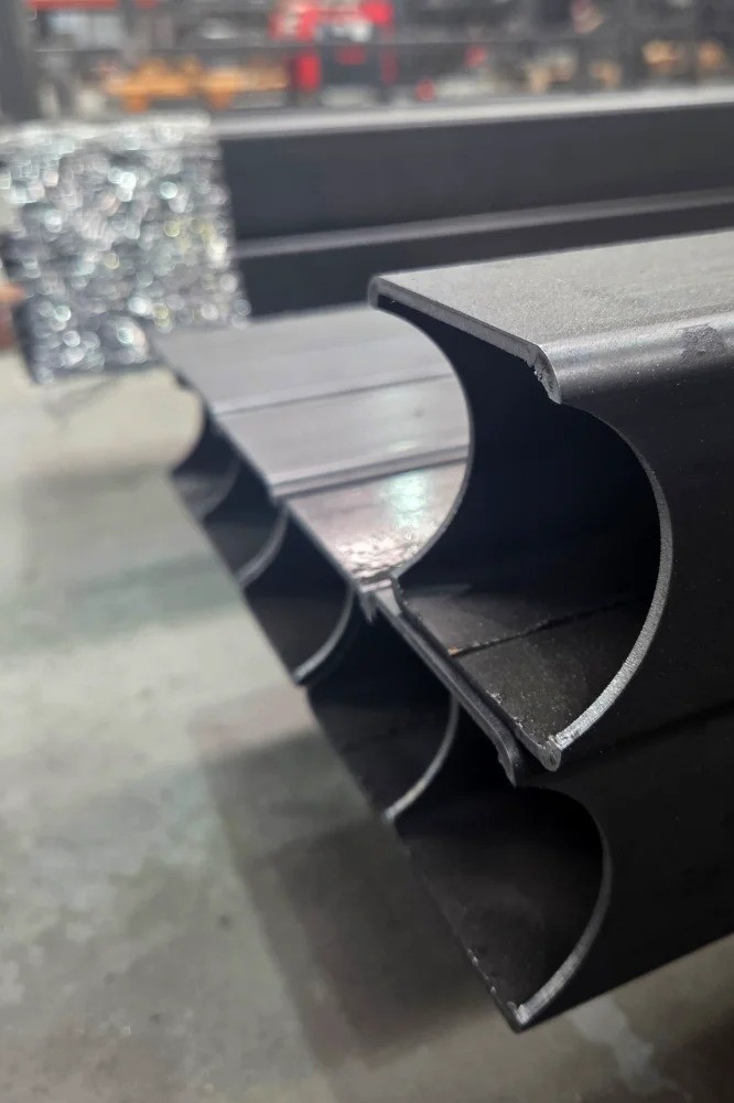 Detail of 3D laser cut steel tubes at V Laser On in Porto, Portugal, showcasing precision tube processing and complex industrial geometry