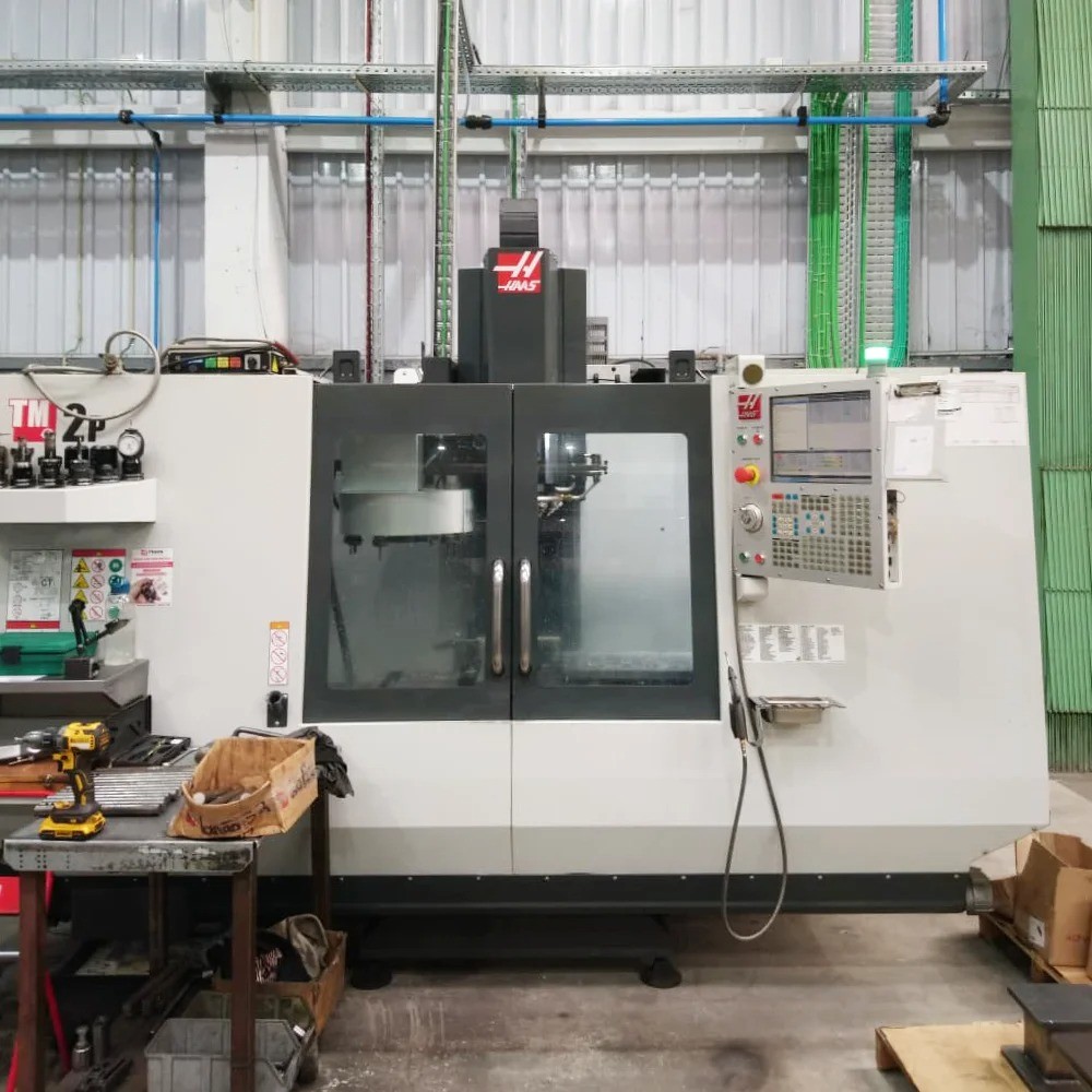 HAAS TM-2P CNC milling machine at V Laser On in Porto Portugal, performing precision milling and turning of metal components for industrial manufacturing