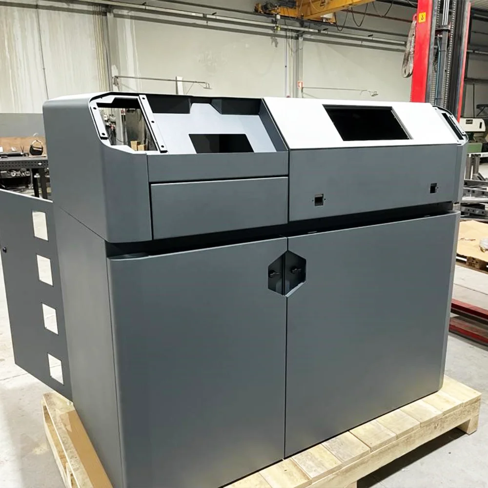 Assembled steel machine enclosure ready in the warehouse at V Laser On in Porto Portugal, showcasing finished sheet metal assembly for industrial machinery