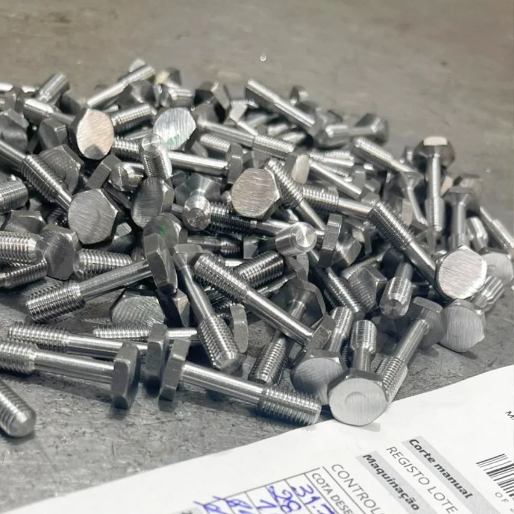 Precision CNC-machined steel screws at V Laser On workshop in Porto Portugal, showcasing high-quality industrial threading and machining for mechanical components