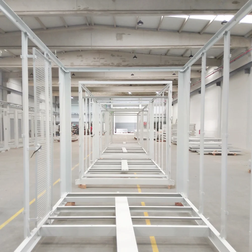 Assembly workshop at V Laser On in Porto Portugal with multiple electrical cabinet structures for photovoltaic solar power systems being assembled on the production line
