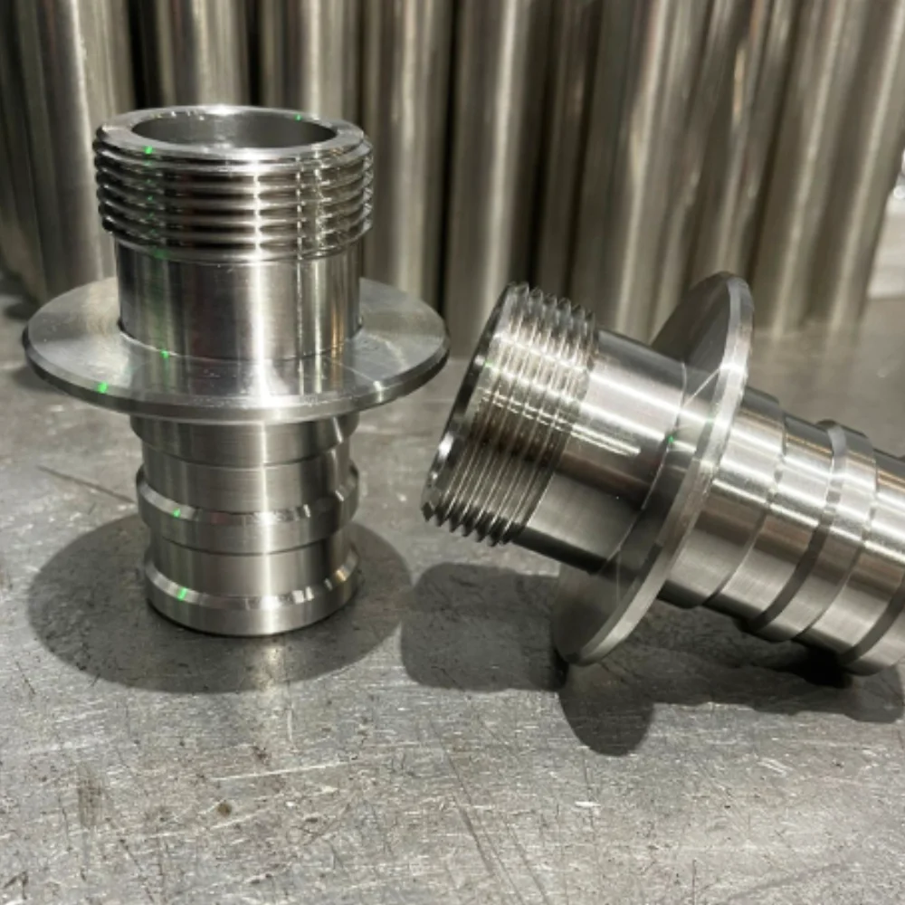 Two stainless steel cylindrical parts CNC turned on a lathe, manufactured by V Laser On in Porto Portugal for European machinery manufacturers